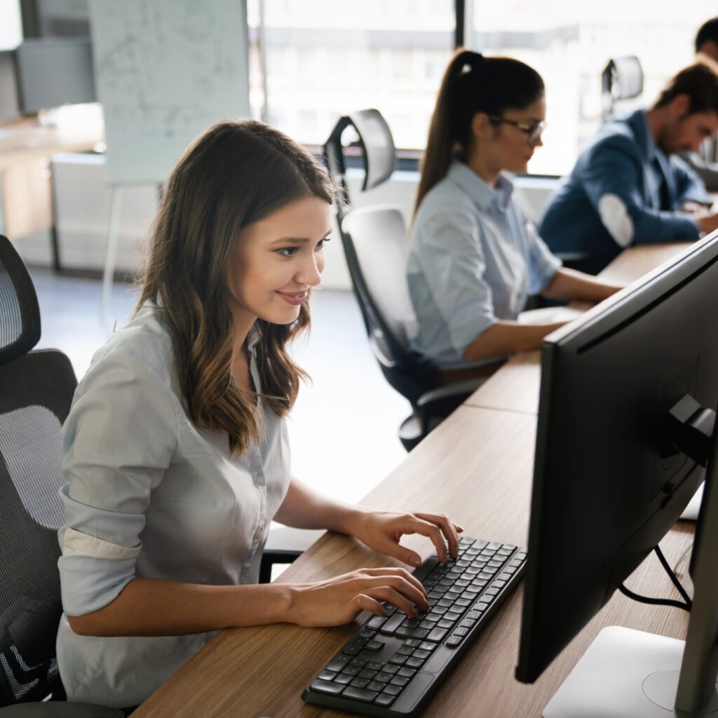 successful happy beautiful woman working at office. technology, computer, startup, business concept.